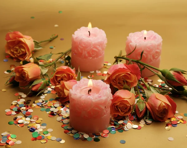Beautiful roses and candles — Stock Photo, Image