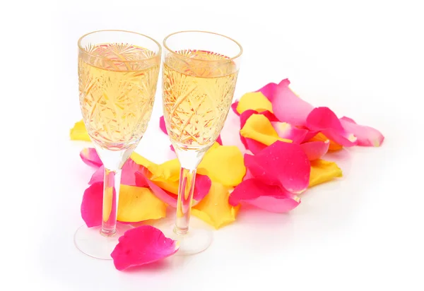 Champagne and rose petals on the white background — Stock Photo, Image