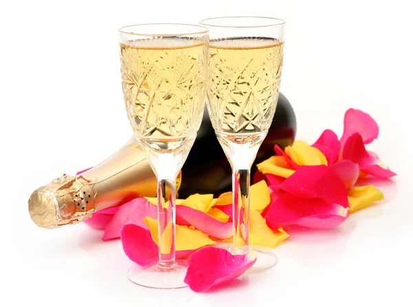 Champagne and rose petals on the white background — Stock Photo, Image