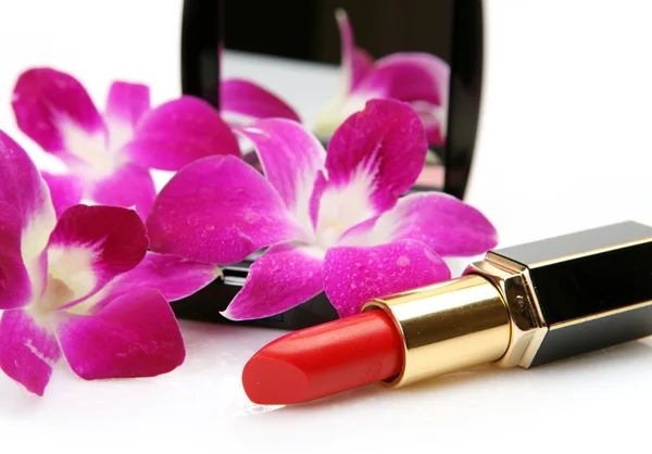 Decoratieve cosmetica en bloemen — Stockfoto