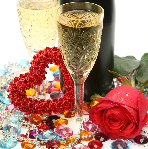 Champagne en rood roze — Stockfoto