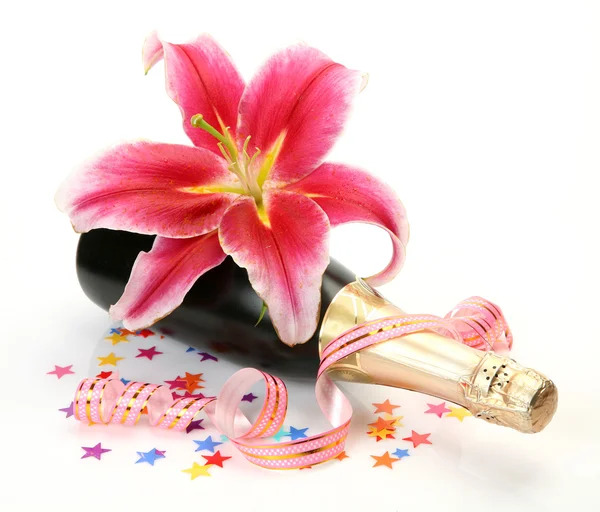 Champagne and pink lilies — Stock Photo, Image