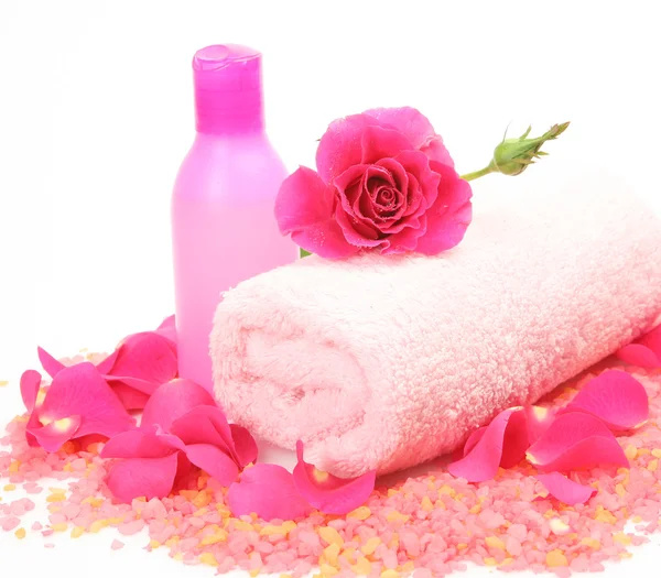 Bottle, towel and rose — Stock Photo, Image