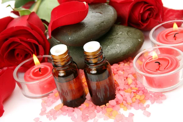 Aromatic oil and candles — Stock Photo, Image