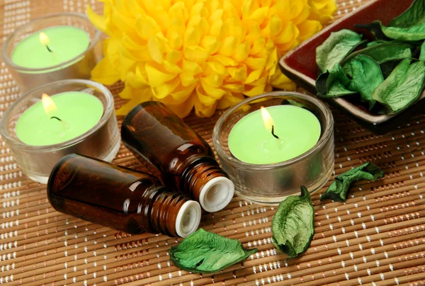 Aromatic oil and candles — Stock Photo, Image