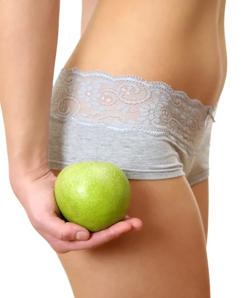 Female body with green apple in hand — Stock Photo, Image