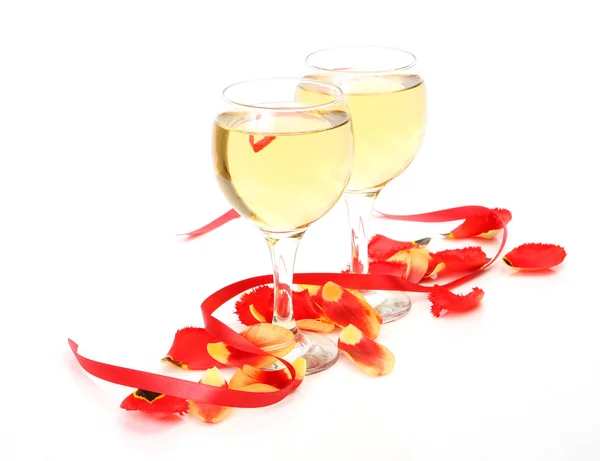 Wine and petals of  tulips — Stock Photo, Image
