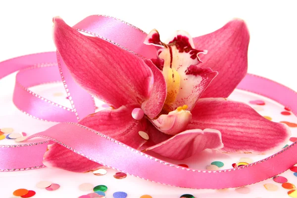 Pink orchid and confetti — Stock Photo, Image