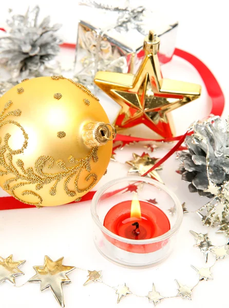Burning candles and Christmas ornaments — Stock Photo, Image