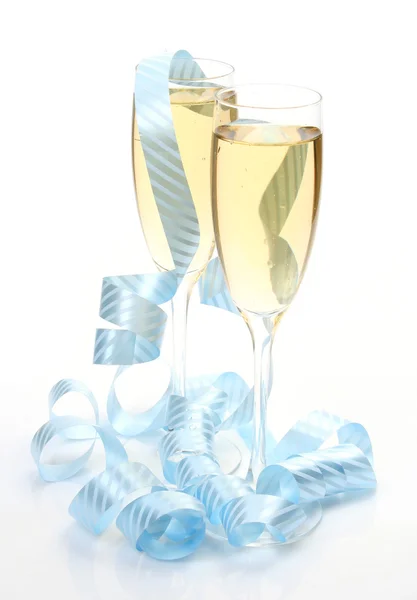 Šampaňské a modré pásky Royalty Free Stock Fotografie