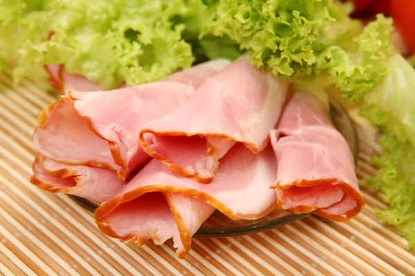 Appetizing ham with lettuce — Stock Photo, Image