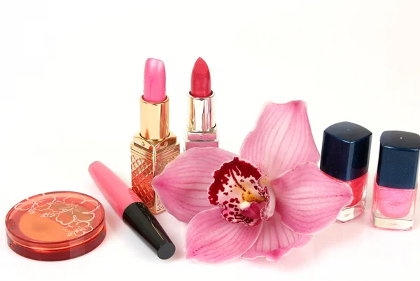 Decorative cosmetics with orchid flower — Stock Photo, Image