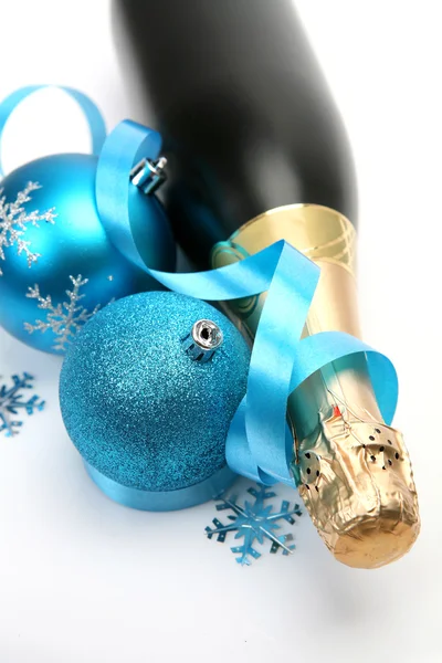 Champagne and blue Christmas toys — Stock Photo, Image