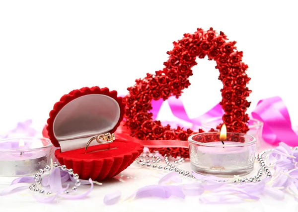 Scarlet heart with ring with romantic decorations — Stock Photo, Image