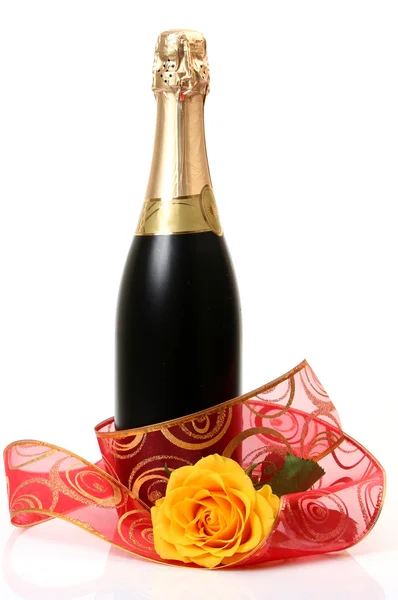 Champagne and decorative tape — Stock Photo, Image