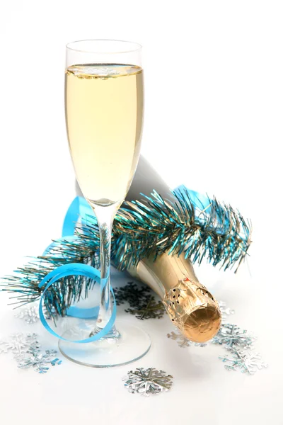 Champagne and tinsel on white — Stock Photo, Image