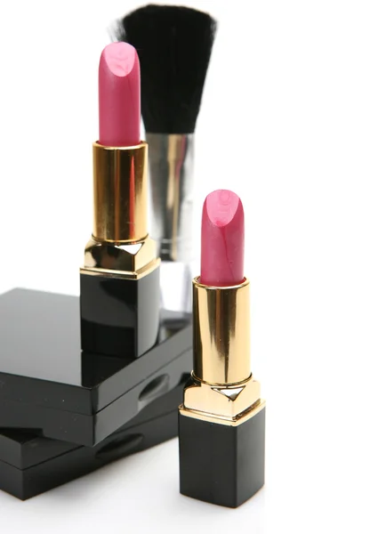 Roze lippenstift met zwart poeder doos — Stockfoto