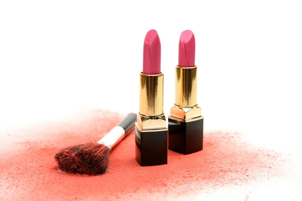 Two lipsticks and a brush — Stock Photo, Image
