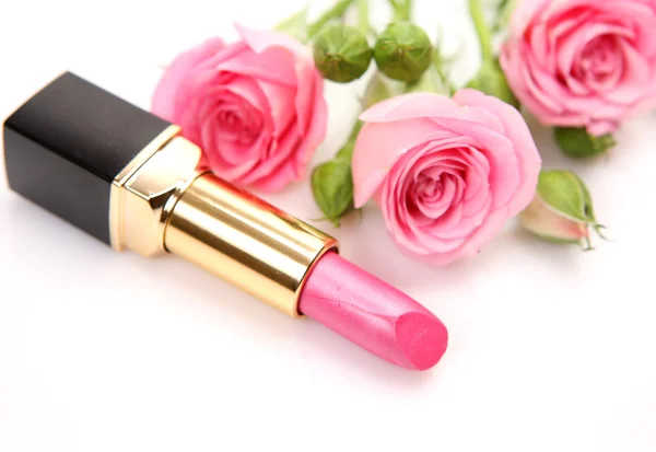 Pink lipstick and roses on white Stock Photo