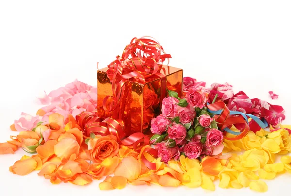 Box with a gift and flowers — Stock Photo, Image