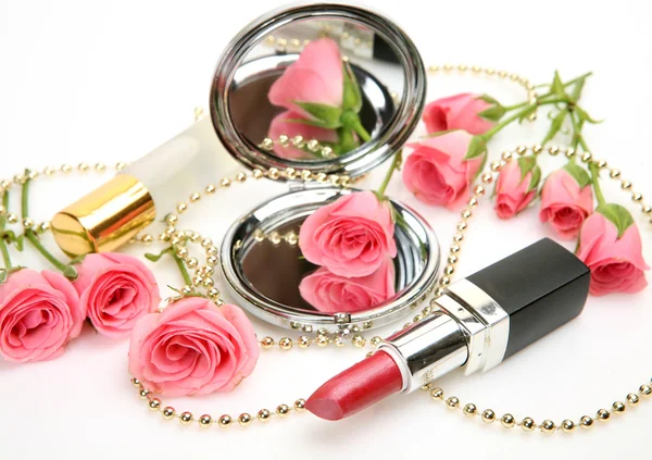 Pink roses, mirror and lipstick — Stock Photo, Image