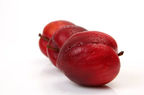 Ripe plums on white — Stock Photo, Image