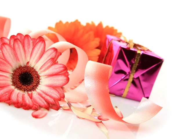 Flowers and box with gift Stock Image