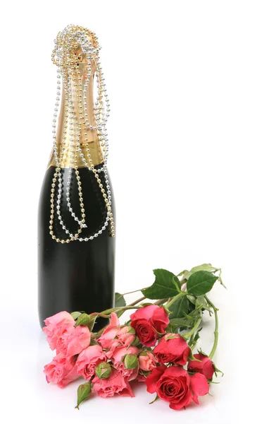 Láhev šampaňského a růže — Stock fotografie