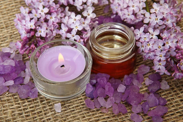 Massage oil and blooming lilac — Stock Photo, Image