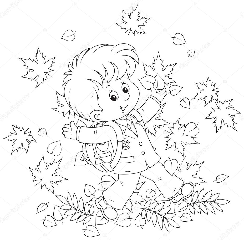 Schoolboy with autumn leaves