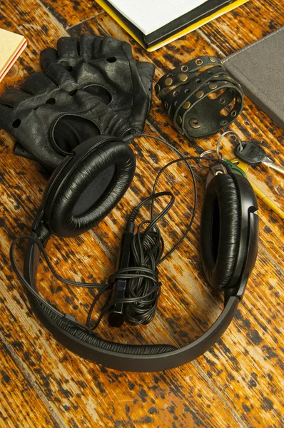 Black headphones,notebook ,key and gloves — Stock Photo, Image