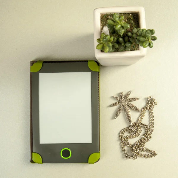 Plant, tablet,necklace — Stock Photo, Image