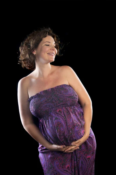 Pregnant woman touching her belly — Stock Photo, Image