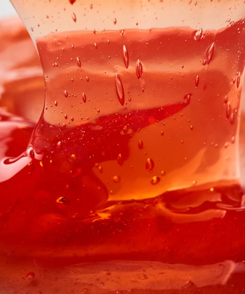 Textura Del Gel Cosmético Transparente Rojo Fondo Abstracto — Foto de Stock