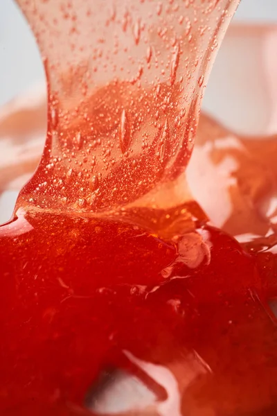 Die Textur Des Roten Transparenten Kosmetikgels Abstrakter Hintergrund — Stockfoto