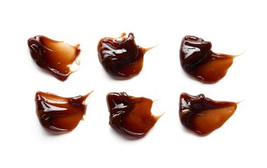 Çikolata renkli jel lekesi ve doku. Beyaz zemin üzerinde kozmetik jel veya karamel şurubu