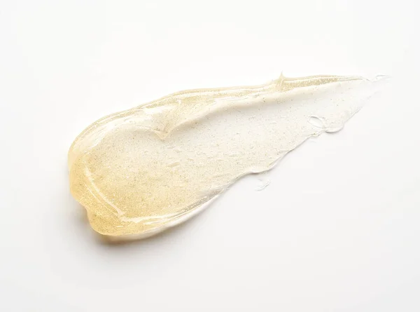 Transparent Smear Texture Golden Cosmetic Gel White Background — Foto Stock