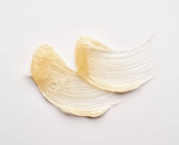 Transparent Smear Texture Golden Cosmetic Gel White Background — Stock Photo, Image