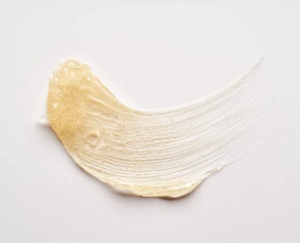 Transparent Smear Texture Golden Cosmetic Gel White Background — Stock Photo, Image
