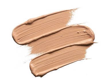 Beyazlar üzerinde izole edilmiş bej renkte renkler ve makyaj temeli dokusu veya akrilik boya