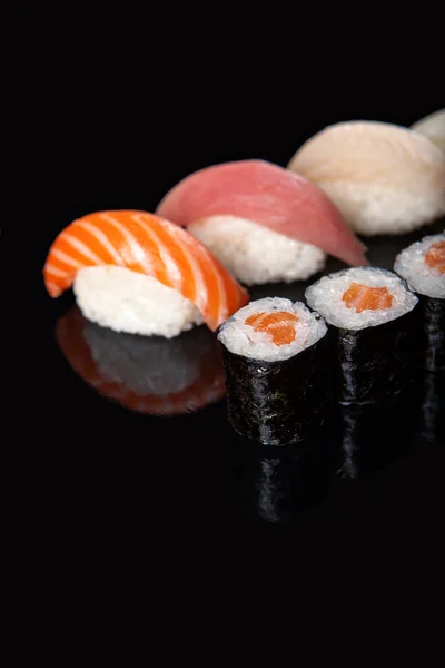 Sushi rolls and sashimi — Stock Photo, Image