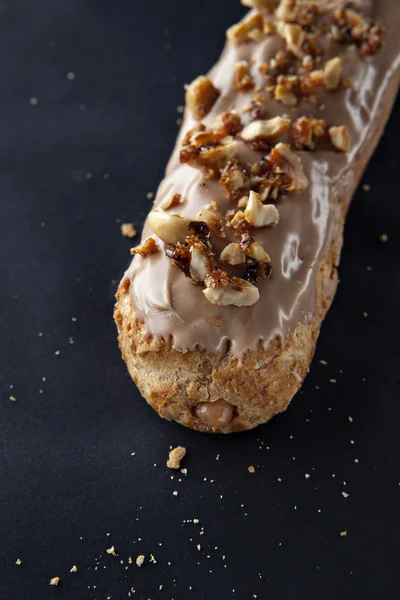 Exquisite cream dessert eclair — Stock Photo, Image