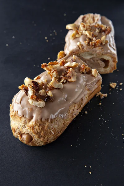 Exquisite cream dessert eclair — Stock Photo, Image