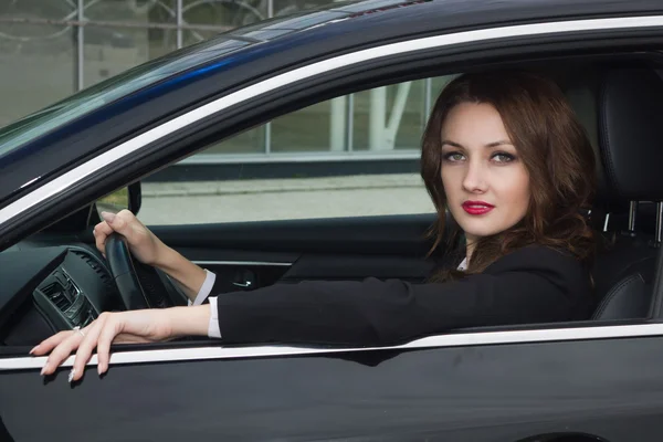 Young confident businesswoman driving car — Stock Photo, Image
