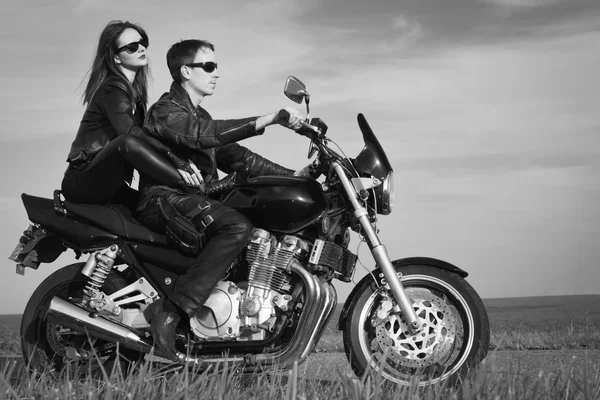 Active couple riding on the motorbike — Stock Photo, Image