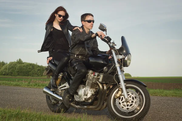 Active couple riding on the motorbike — Stock Photo, Image