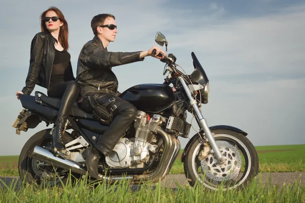 Active couple riding on the motorbike — Stock Photo, Image