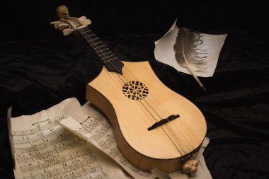 Renaissance lute (citole) with musical notes clipart