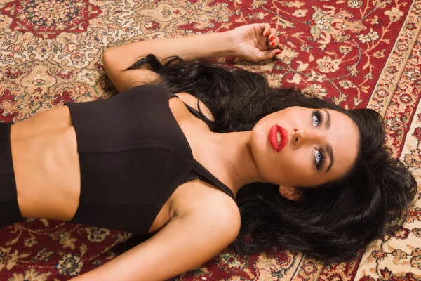 Sensual unconscious woman lying on the floor — Stock Photo, Image