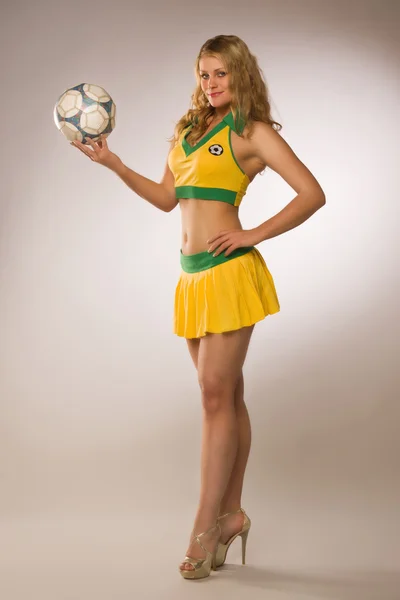 Beautiful sexy blond cheerleader whit soccer ball — Stock Photo, Image